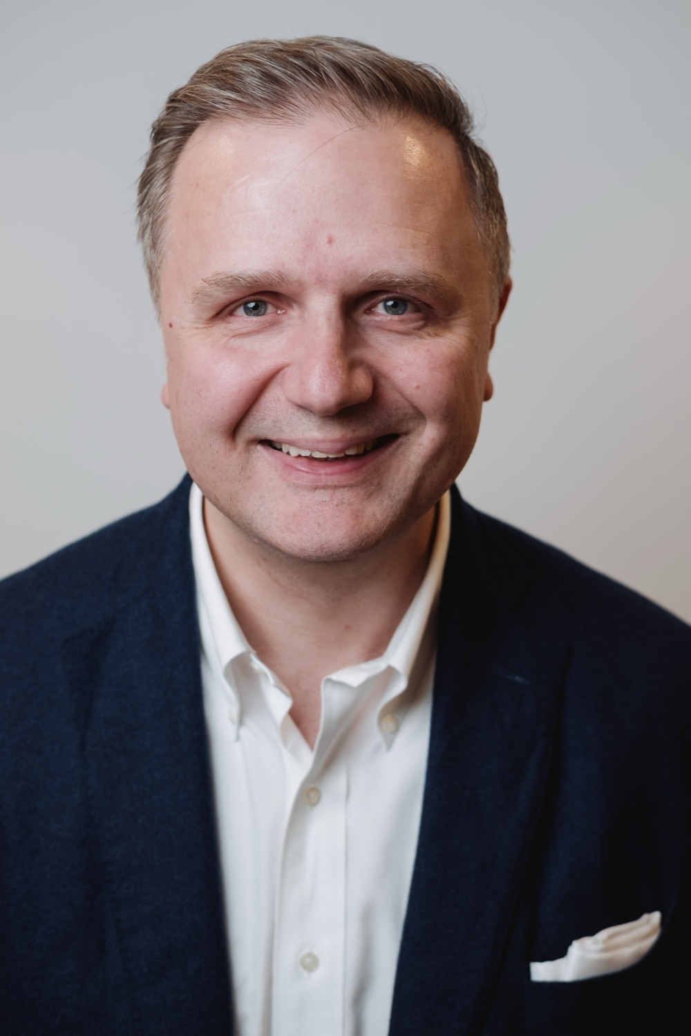 Executive portrait in a navy blazer, on-site session, London