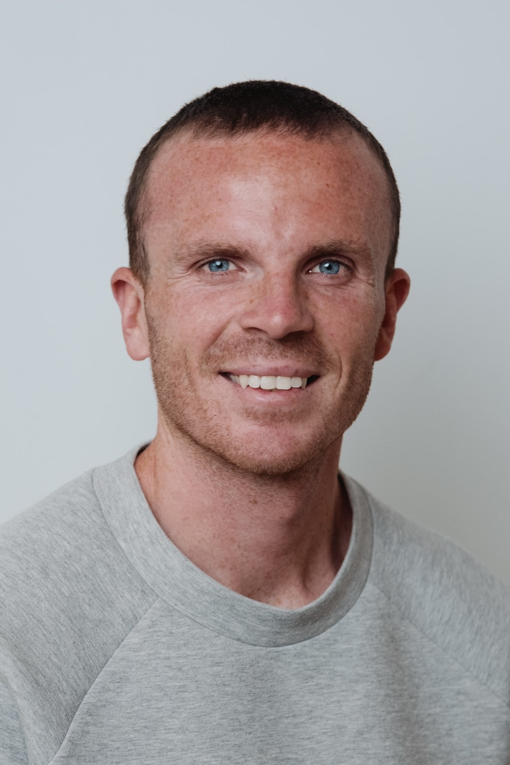 Team headshot against a neutral backdrop, London office