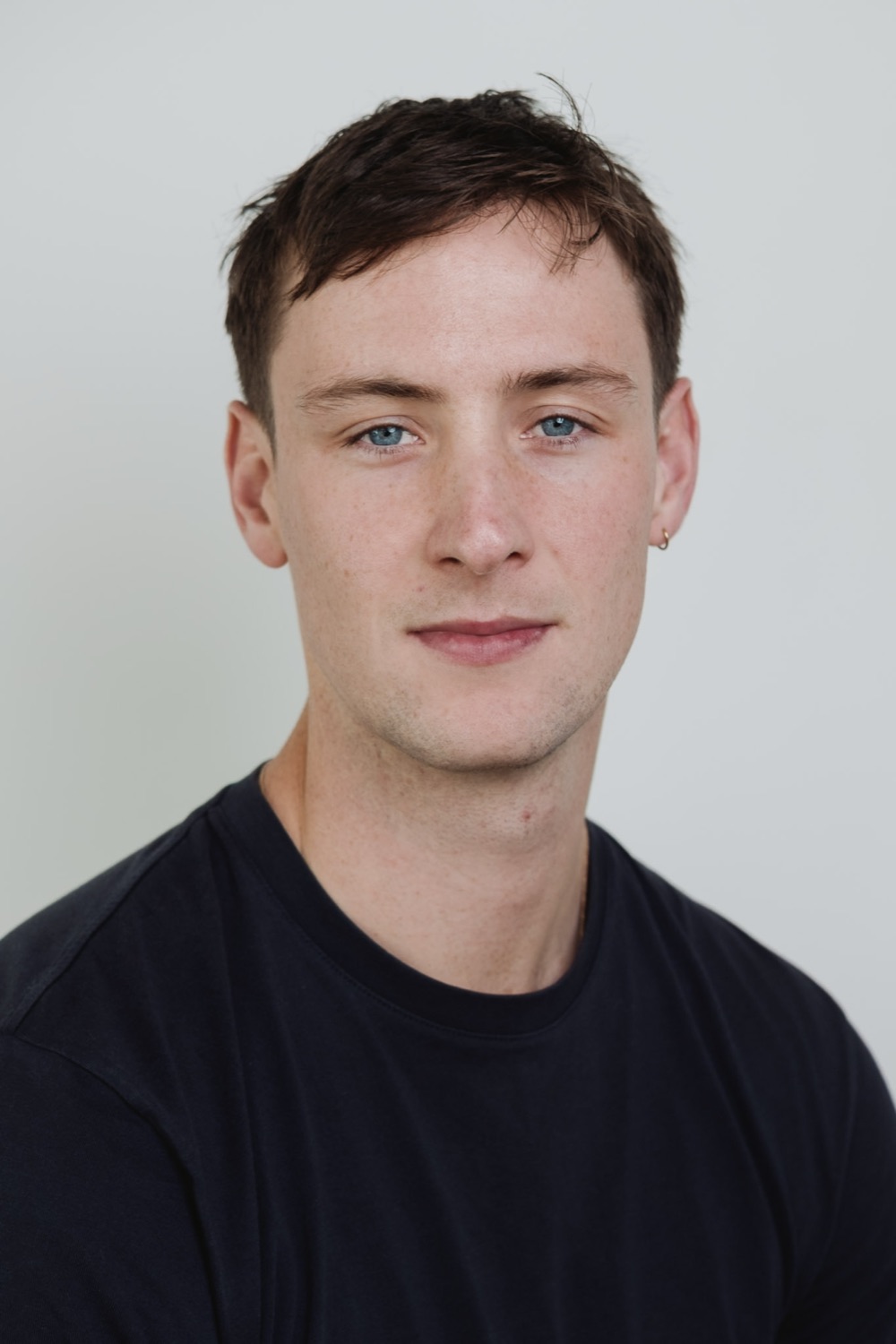 Corporate headshot, clean neutral backdrop, on-site session, London
