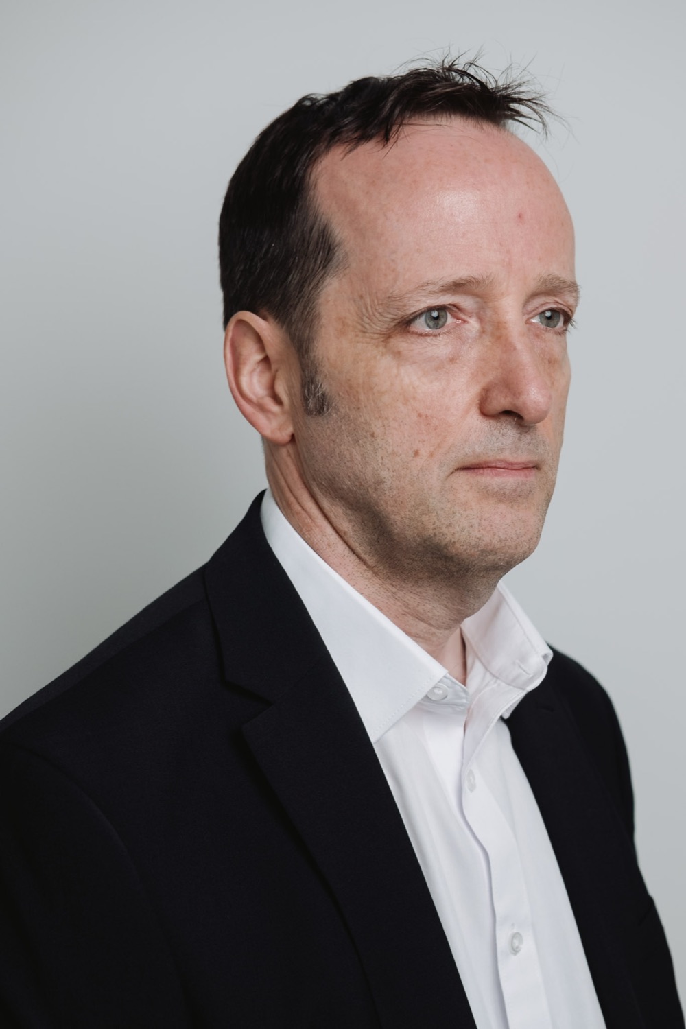 Executive portrait with editorial lighting, London office session