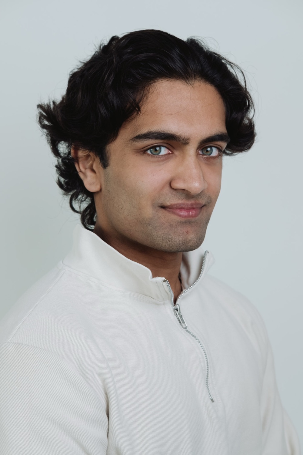 Professional headshot from a team session, neutral backdrop, London